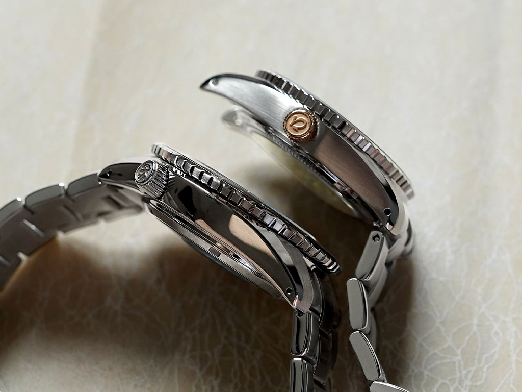 The Meguro (top) has a satin-brushed finishing as compared to the GS GMT (Bottom).
