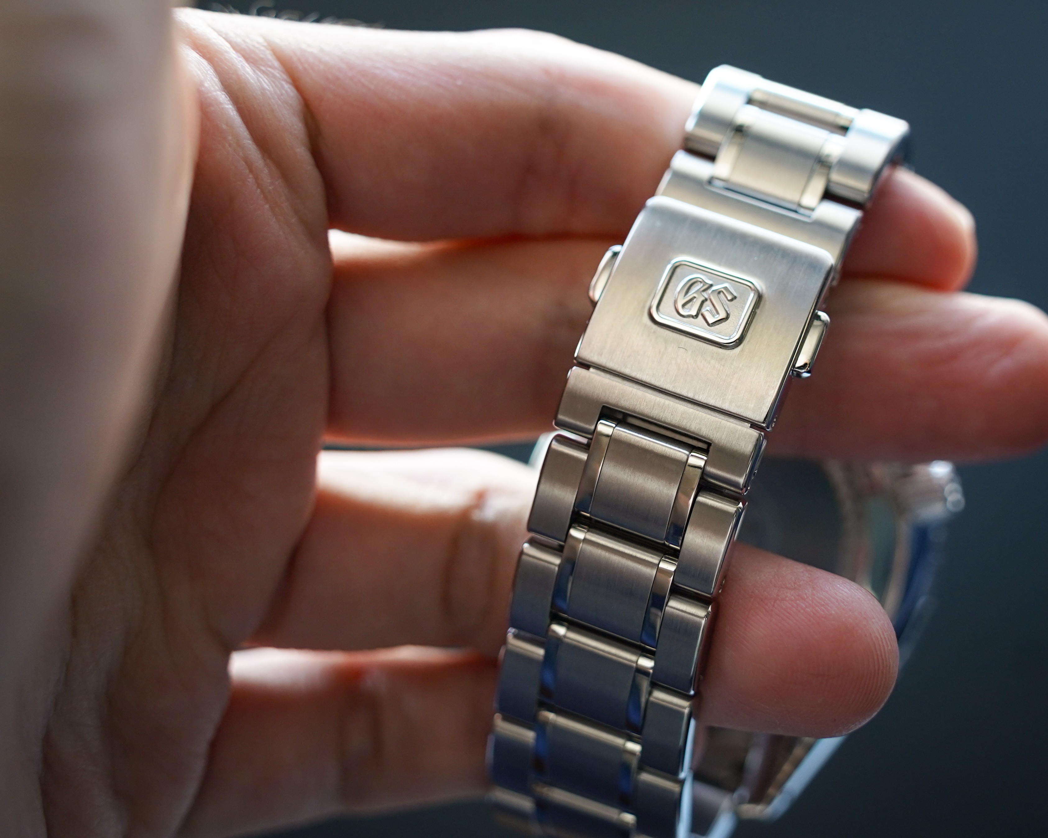 The bi-fold clasp from GS might not be apt for a sports watch, but serving its purpose nevertheless.